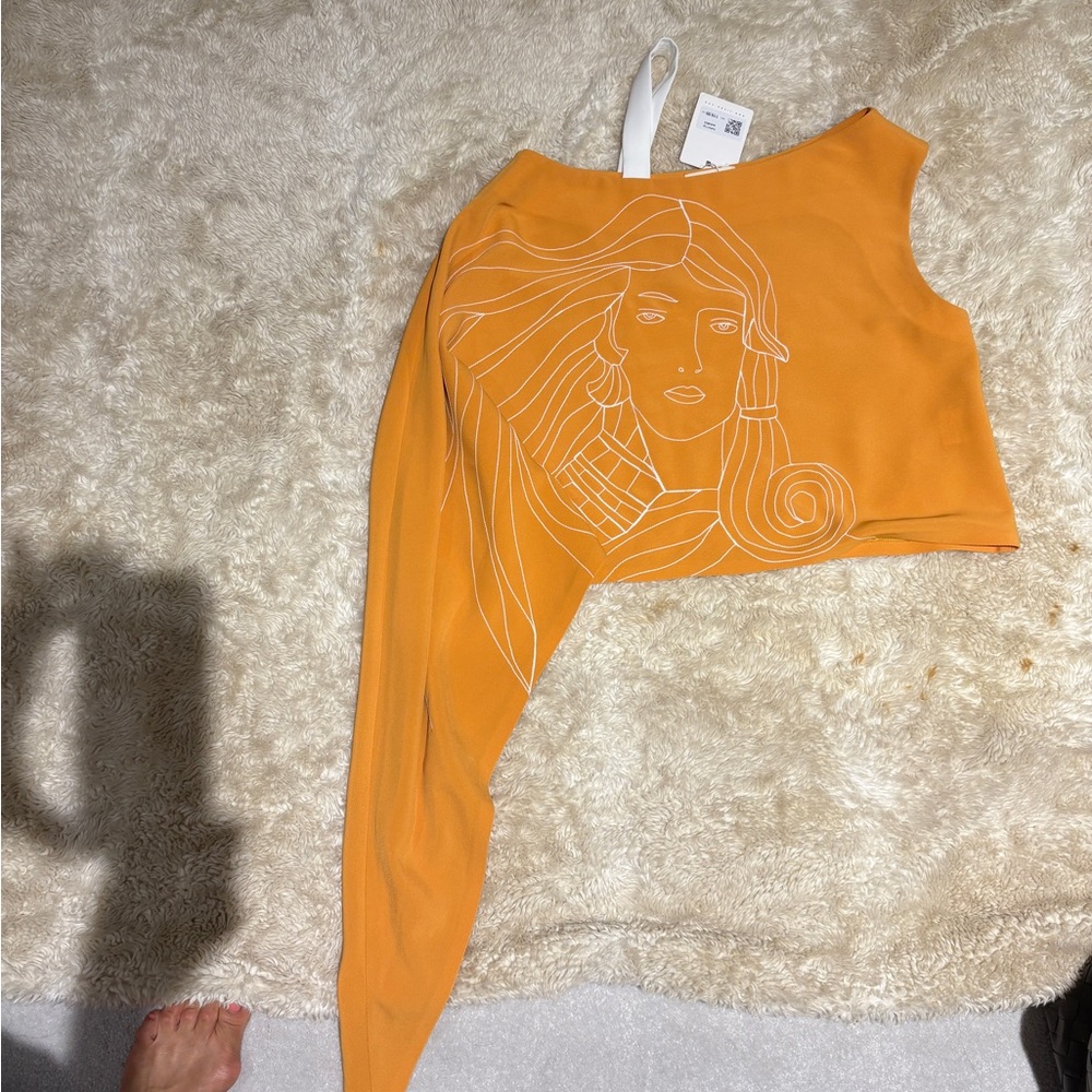 Asymmetrical Orange Top with Artistic Design